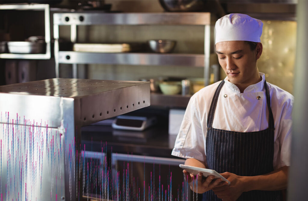 restaurant chef using a calculator to figure out food costs. Rising food cost and 5 ways insidetrack can help control it